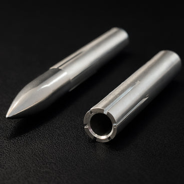 Two metal cylindrical objects on a black background