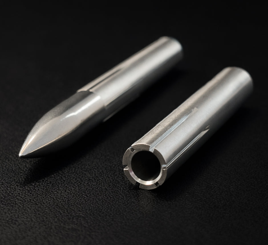 Two metal cylindrical objects on a black background