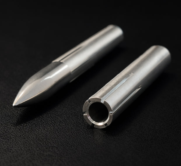 Two metal cylindrical objects on a black background
