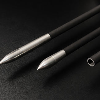 Three arrow shafts. Each with different ends on black background