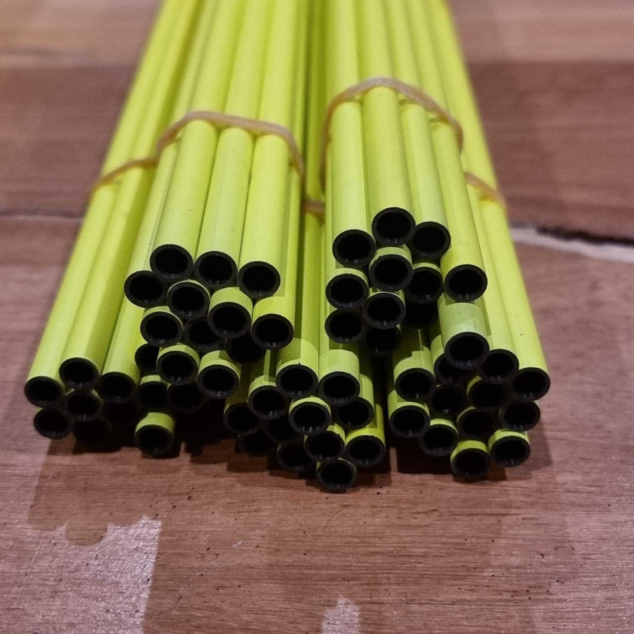 Open ends of Orranni Slayer Yellow 30T .204 carbon arrow shafts showing shaft diameter
